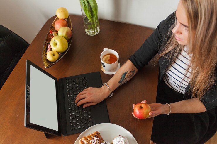 Apple is More Effective in Waking You Up in the Morning Than Coffee 1 tattooed woman laptop top view 23 2147625137