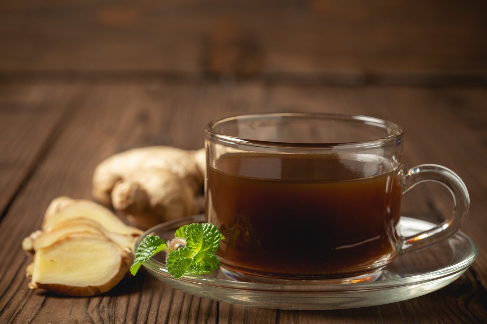 hot ginger juice ginger sliced wooden table min scaled